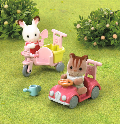 SYLVANIAN Trójkołowy rower z zabawkami 05040