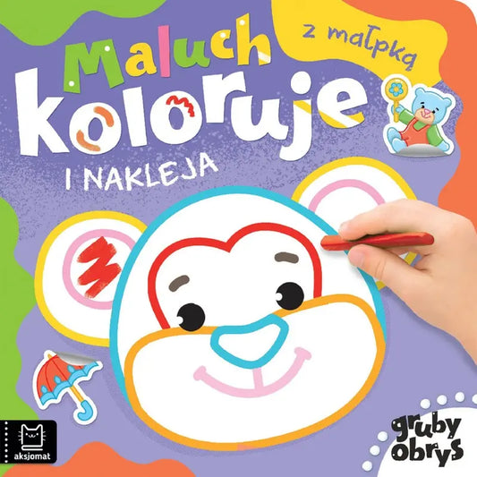 Maluch koloruje i nakleja z małpką gruby obrys