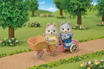 Sylvanian pieski husky na rowerze
